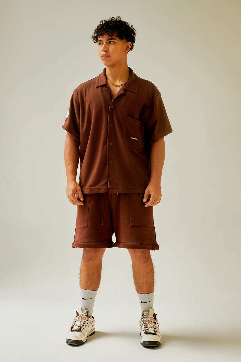 Camisa chocolate manga corta con bolsillo bordado Kavans